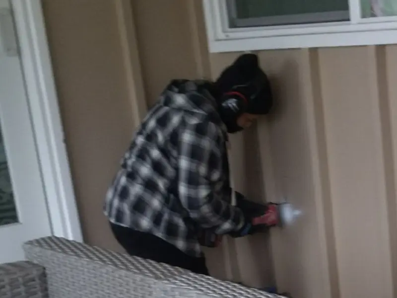 Professional electrician installing an exterior outlet in Richmond