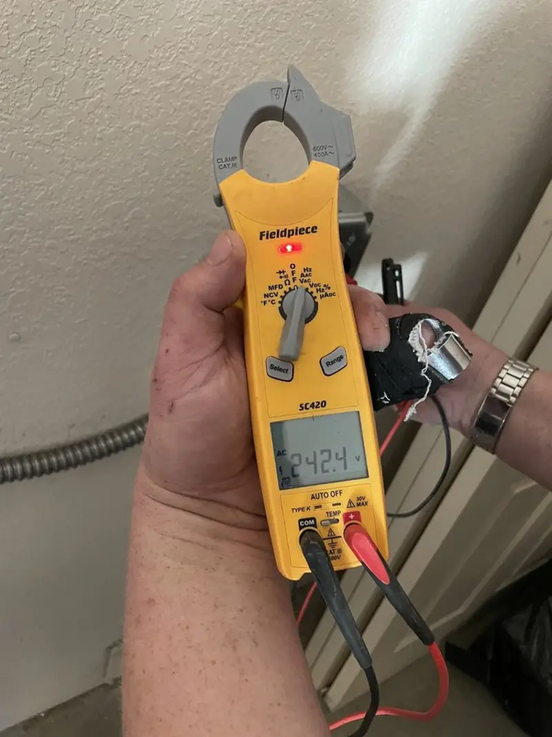 Voltage testing with clamp meter during Ceiling Fan Installation in Richmond
